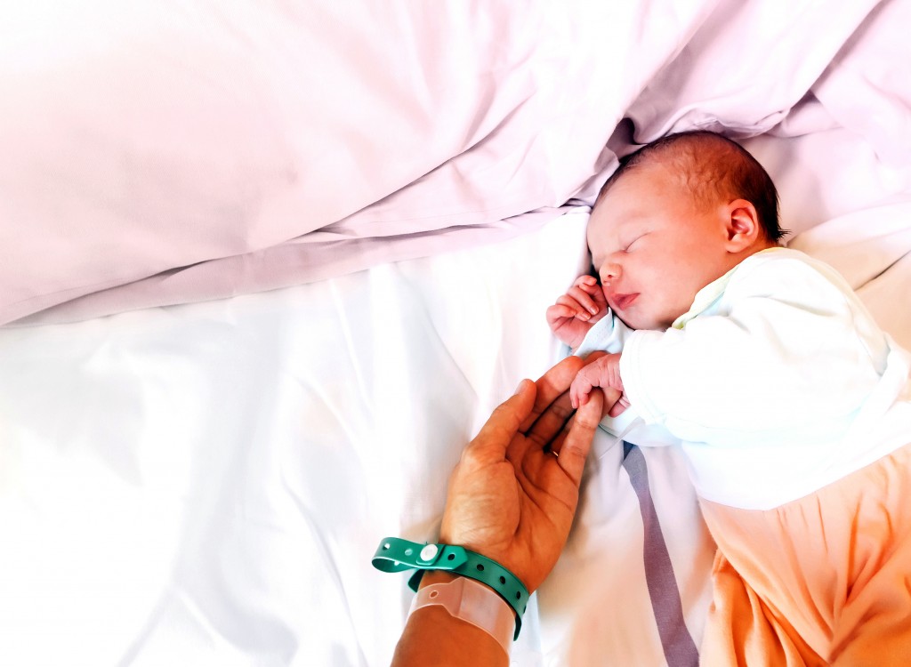 Newborn baby first days of life after childbirth.